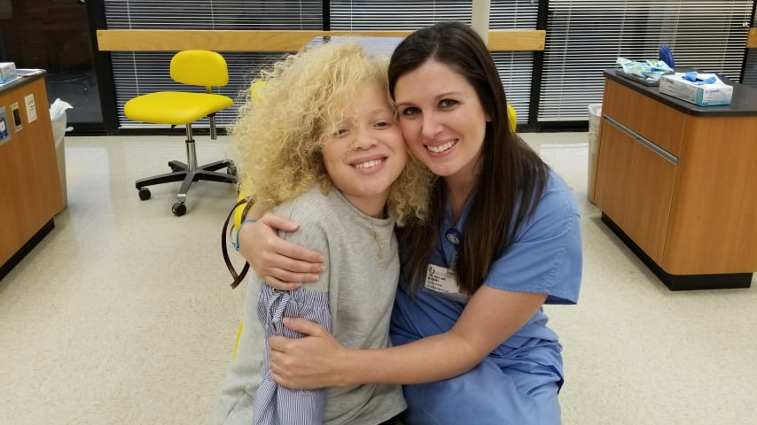 Ava Clarke Edney with a healthcare provider from Children’s Miracle Network Hospitals. (Courtesy Edney family)