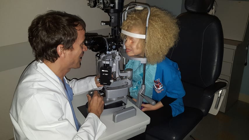 Edney receiving an eye exam as a child. (Credit Edney family)