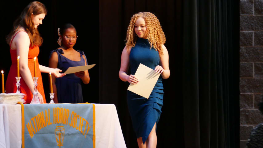 Edney receiving a certificate as part of the National Honor Society. (Credit Edney family)