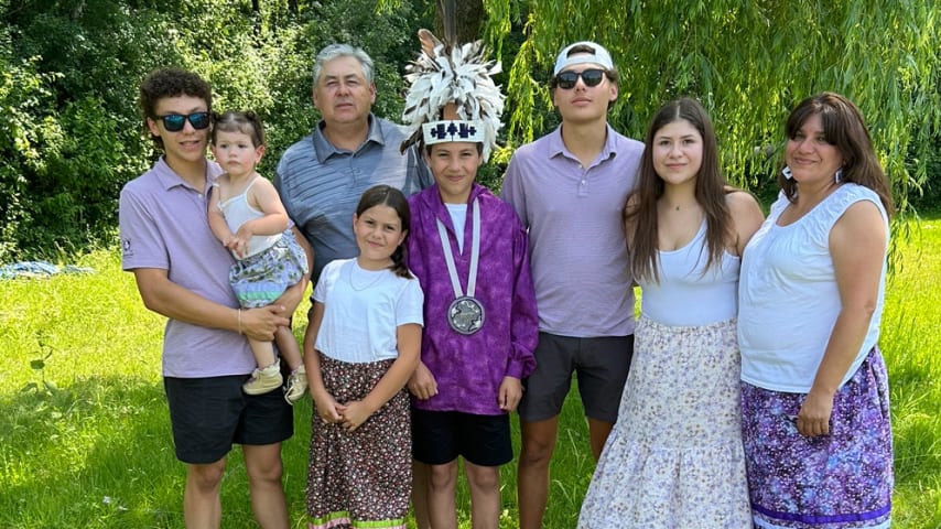 Rahontsá:waks (middle, pictured with family) served as a flag bearer at the International Team's Opening Ceremonies for the 2024 Presidents Cup. (Courtesy Lacey Paul)